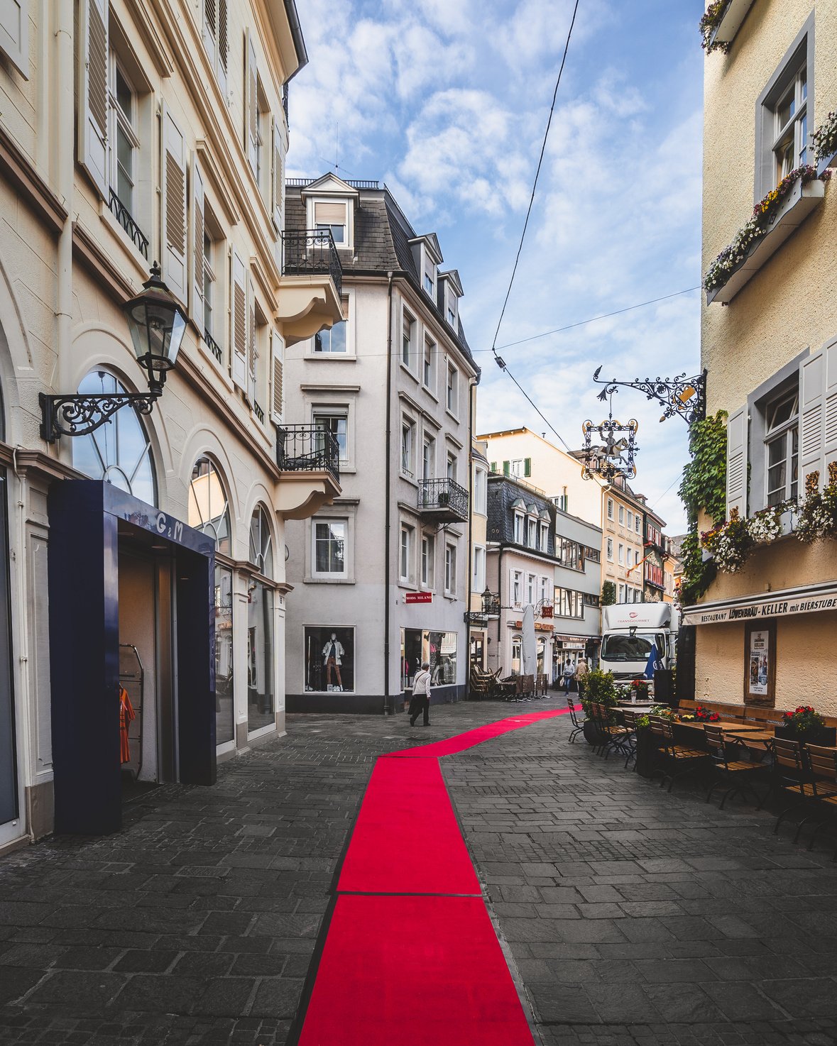 Red Carpet in the Middle of Road Between Buildings